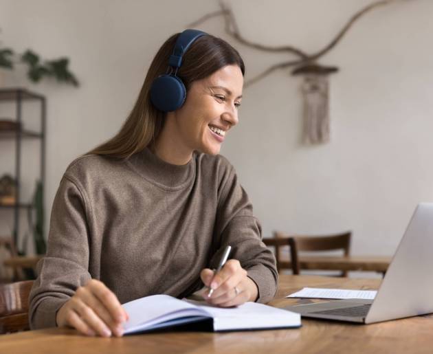 Happy,Adult,Student,Woman,Studying,On,Internet,,Using,Laptop,,Wireless