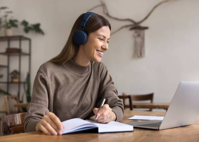 Happy,Adult,Student,Woman,Studying,On,Internet,,Using,Laptop,,Wireless